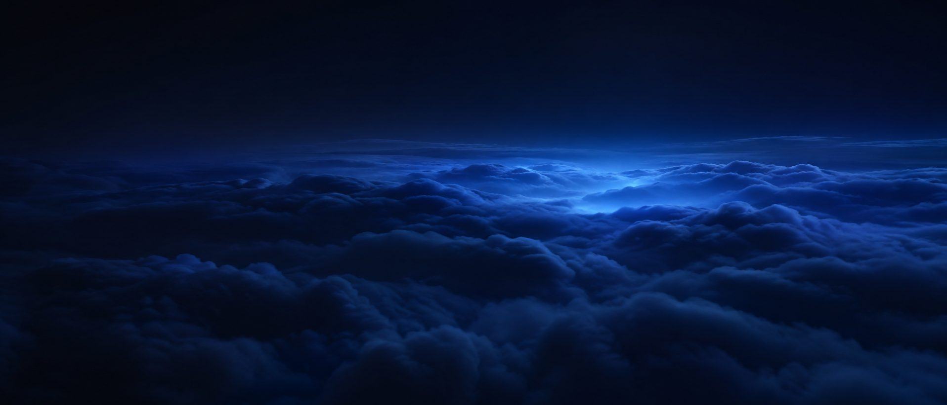 Blue morning light above clouds